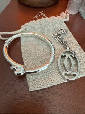 Jenny Bird Polished Silver Rounded Hinged Bangle & Vintage Cartier Bag Charm